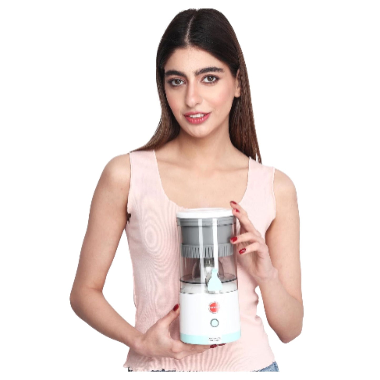 Woman holding portable electric orange squeezer citrus juicer with white base and clear container