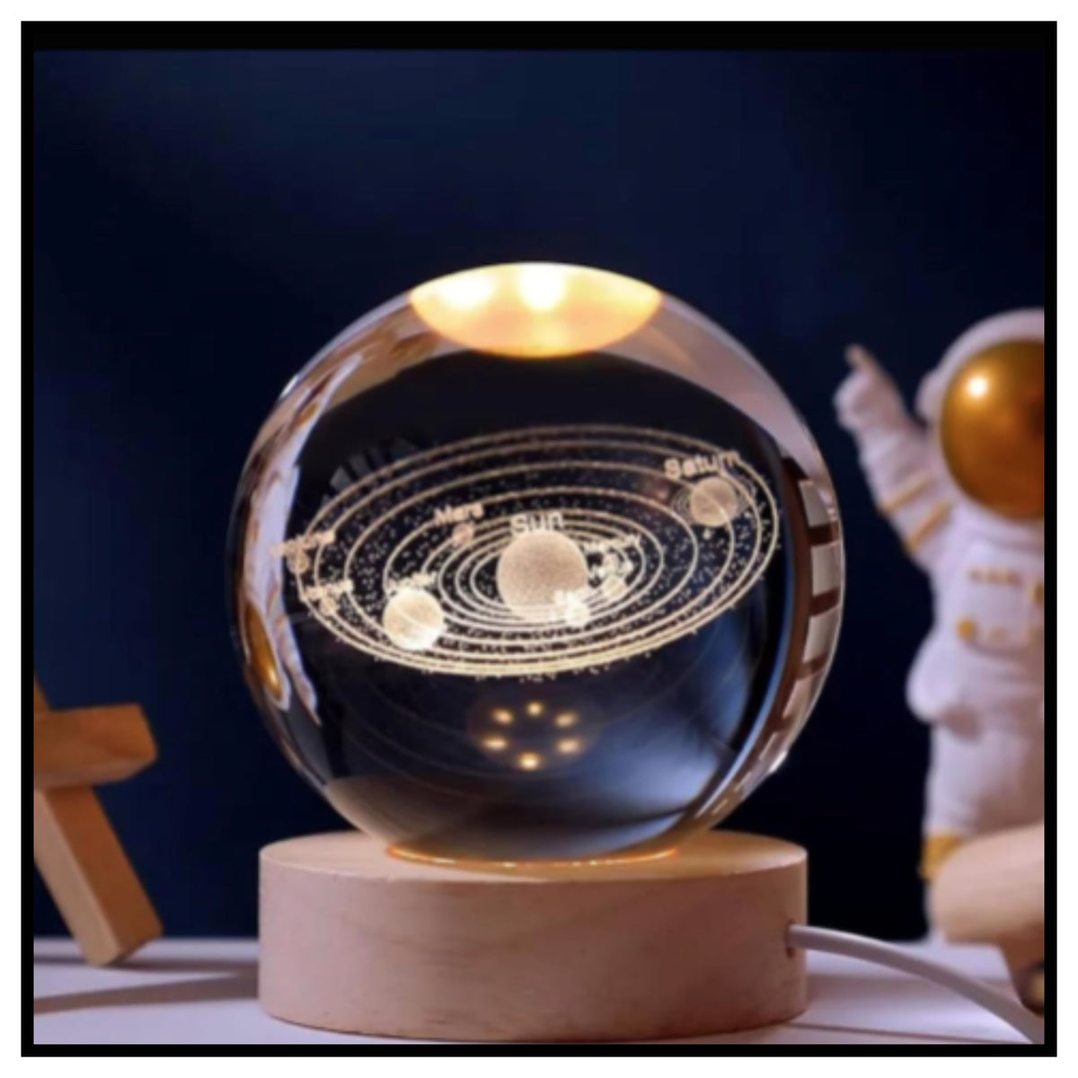 🔮 3D Crystal Ball Night Light – Glowing Glass Sphere with Laser Engraved Solar System on Round Wooden Base with Warm Light and Small Astronaut Figure in Background
