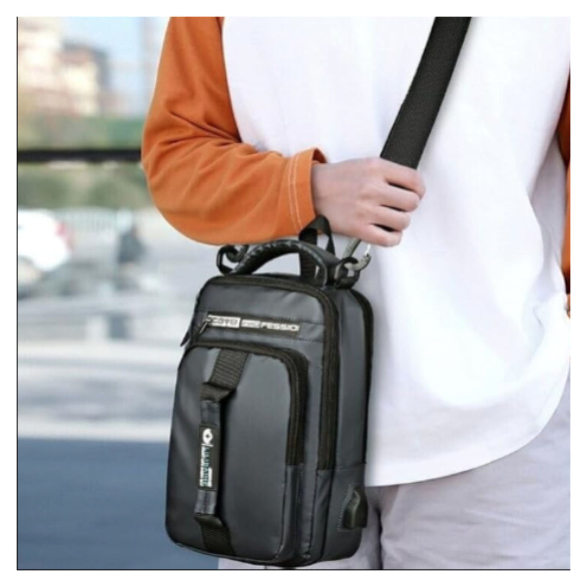 Black waterproof chest sling bag for men with shoulder strap worn as crossbody messenger bag